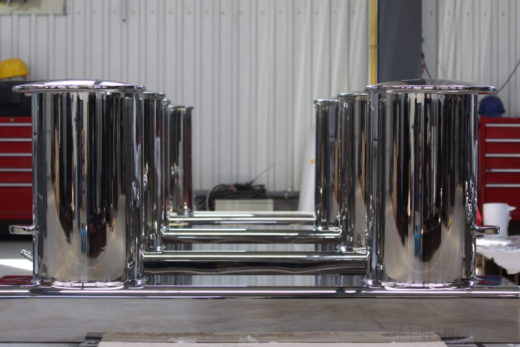 Line of polished bollards displayed from the front